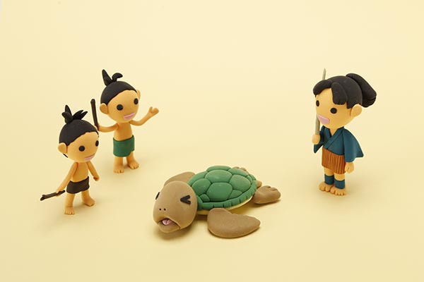 いじめられている亀を助ける浦島太郎